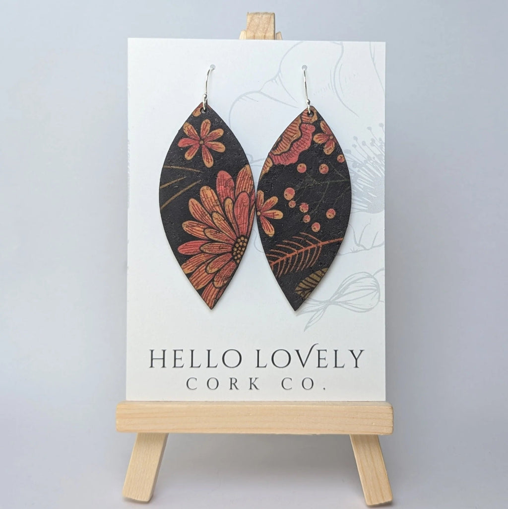 Floral cork earrings on a 'Hello Lovely Cork Co.' card with a wooden stand.