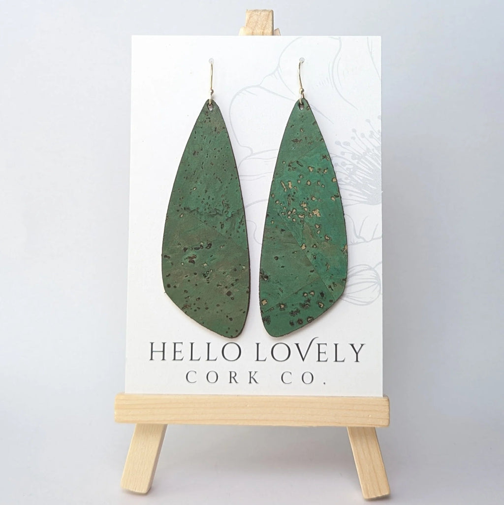 Green cork earrings on a 'Hello Lovely Cork Co.' card with a wooden stand.