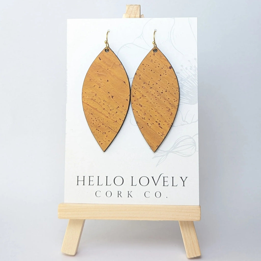 Cork earrings on a 'Hello Lovely Cork Co.' card with a wooden stand.